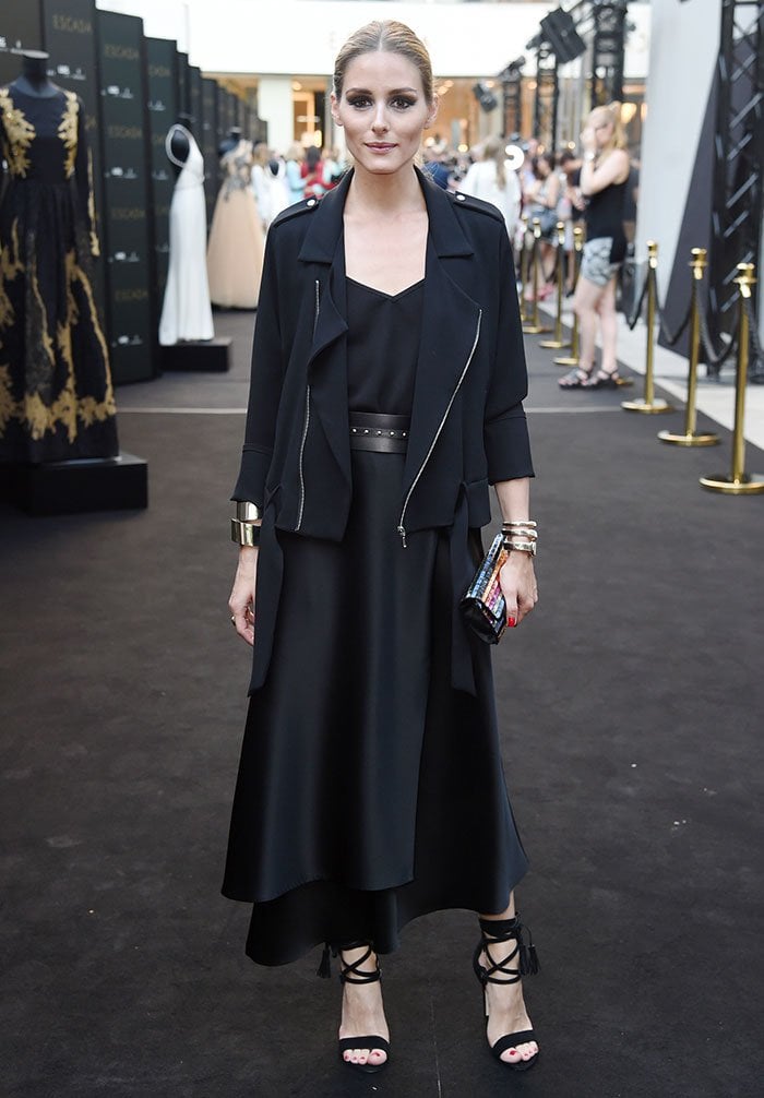 Olivia Palermo pairs layered black Escada separates with lace-up heels for a refined monochrome moment on the event’s black carpet