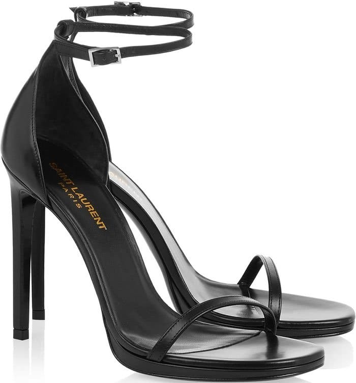 Black Saint Laurent “Jane” Leather Sandals featuring a sleek ankle strap, minimalist toe band, and a leg-lengthening stiletto silhouette