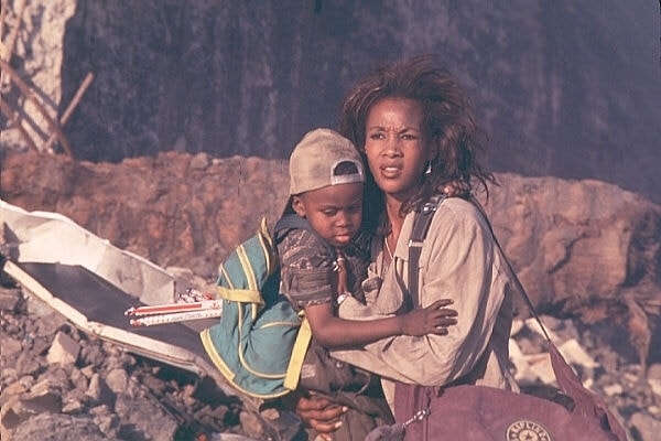 Vivica A. Fox as Jasmine Dubrow, seen protecting her young son Dylan (played by Ross Bagley) in the 1996 sci-fi classic Independence Day