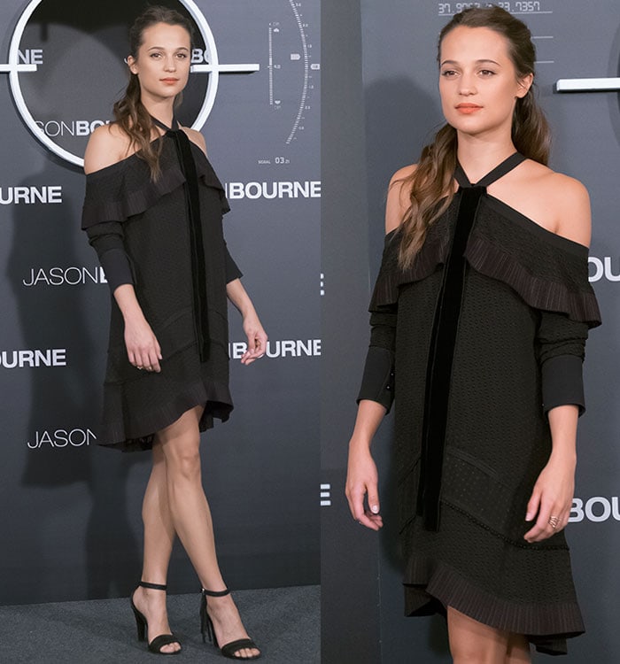 The actress pairs her ruffled LBD with sleek black ankle-strap sandals featuring tassel details