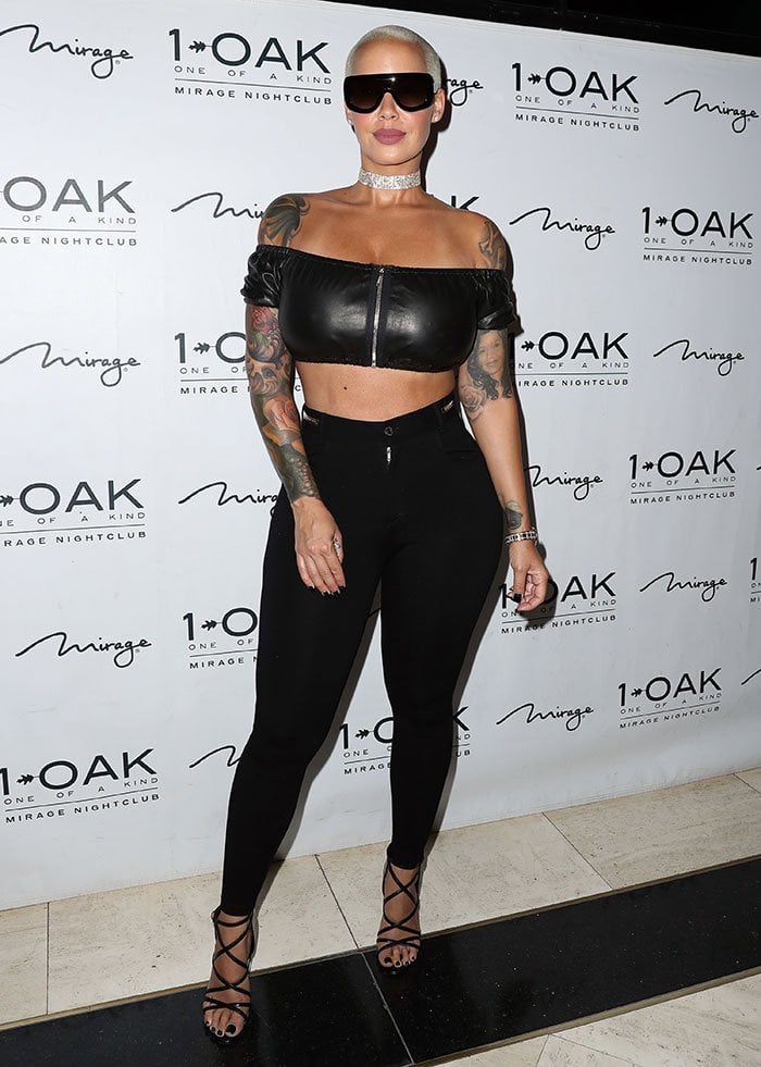 The model highlighted her famous curves in a black off-the-shoulder Alexander Wang crop top and high-waisted Givenchy leggings