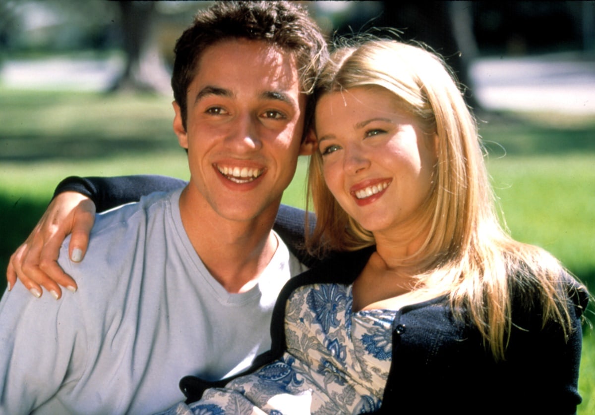 Tara Reid lights up the screen as Vicky Lathum alongside Thomas Ian Nicholas as Kevin Meyers in the coming-of-age classic American Pie