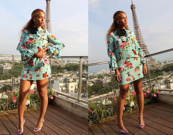 Beyonce adds a touch of French flair with a black rose pin while posing with Blue Ivy in matching Gucci outfits