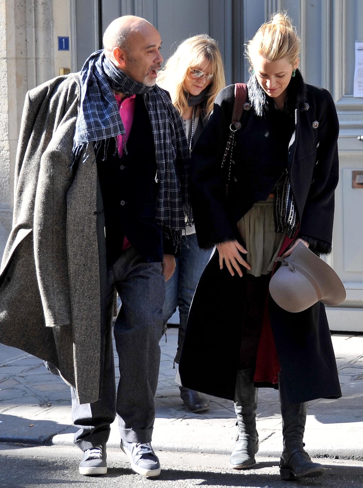 Blake Lively keeps it casual in knee-high black boots while strolling with shoe designer Christian Louboutin in Paris, France, on March 7, 2011