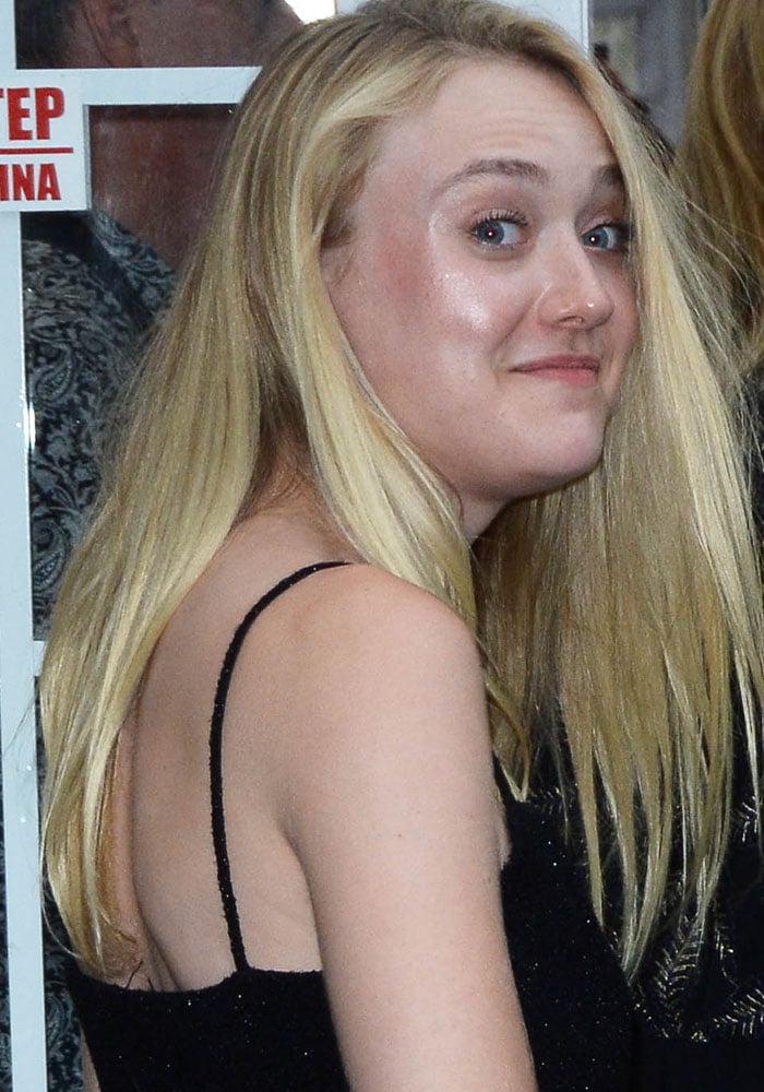Dakota Fanning wears her blonde hair down at the New York premiere of "Cafe Society"