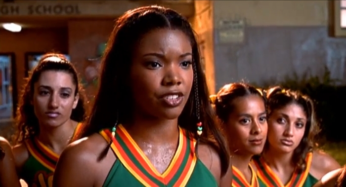 Gabrielle Union as Isis, the determined captain of the East Compton Clovers, in the iconic cheerleading film Bring It On