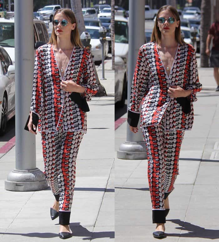 Jaime King turns heads while running errands in Beverly Hills on July 15, 2016, effortlessly rocking a silky strawberry-print pajama set with Tory Burch mules and mirrored sunglasses for a chic off-duty look