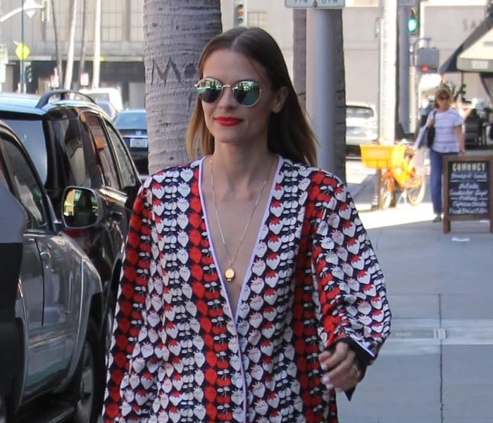 Jaime King’s pajama set features a bold strawberry-print pattern in red, black, and white tones