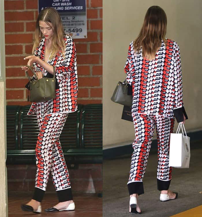 Jaime King completes her pajama-chic look with stylish black-and-white Tory Burch mules, adding a touch of effortless sophistication to her off-duty ensemble