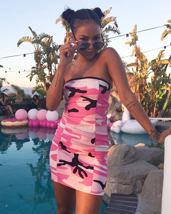 Karrueche Tran taking a poolside photo