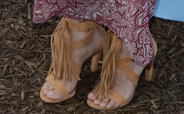 Rachel Bilson grounded her printed maxi dress with tan suede Chloé sandals, their swaying fringe adding movement and a soft bohemian finish
