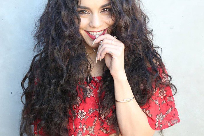 Vanessa Hudgens with tousled beachy waves in a For Love  Lemons crop top with a Pave Black Agate Arrowhead necklace and 5 Diamond bodychain by Jacquie Aiche