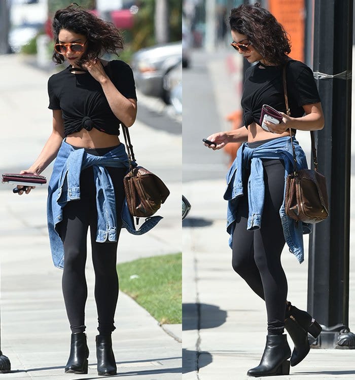Vanessa Hudgens flaunts her toned abs in a crop top and leggings, adding a denim shirt for a chic edge