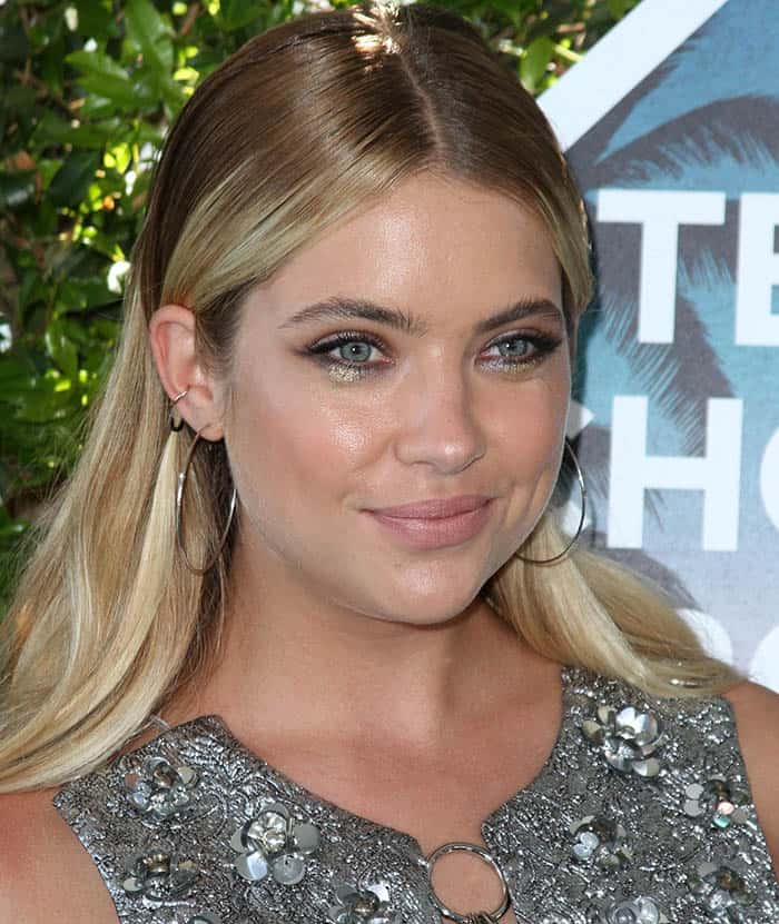 Ashley Benson gracefully adorned herself with a silver floral metallic-embroidered brocade dress from the acclaimed Michael Kors Fall 2016 Collection at the Teen Choice Awards 2016