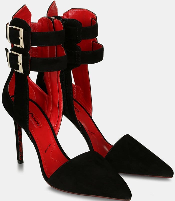 Cesare Paciotti’s black suede “Sveva” pumps stand out with their sharp pointed toe, bold double ankle straps, and signature red interior that underscores the brand’s sultry, Italian-made edge
