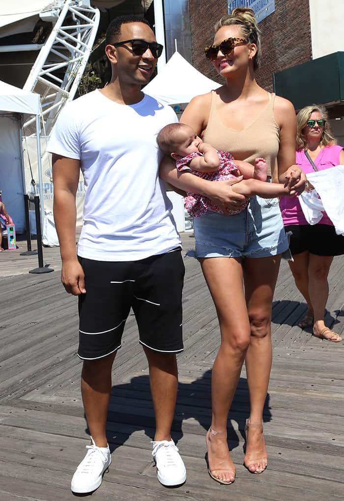 Chrissy Teigen, John Legend and baby Luna Simone at the 2016 Sports Illustrated Summer of Swim Fan Festival Concert at Coney Island Boardwalk in New York City on August 28, 2016
