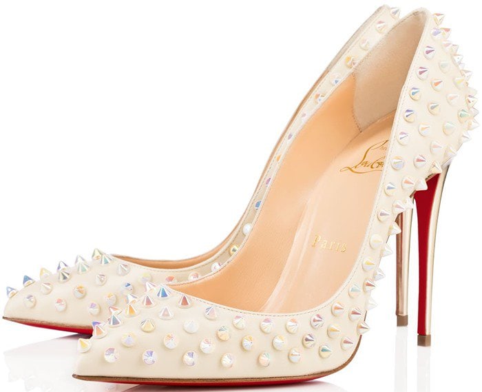 The white leather Christian Louboutin “Follies Spikes” pumps are finished with iridescent studs, combining a sleek pointed toe with a luminous, statement-making edge