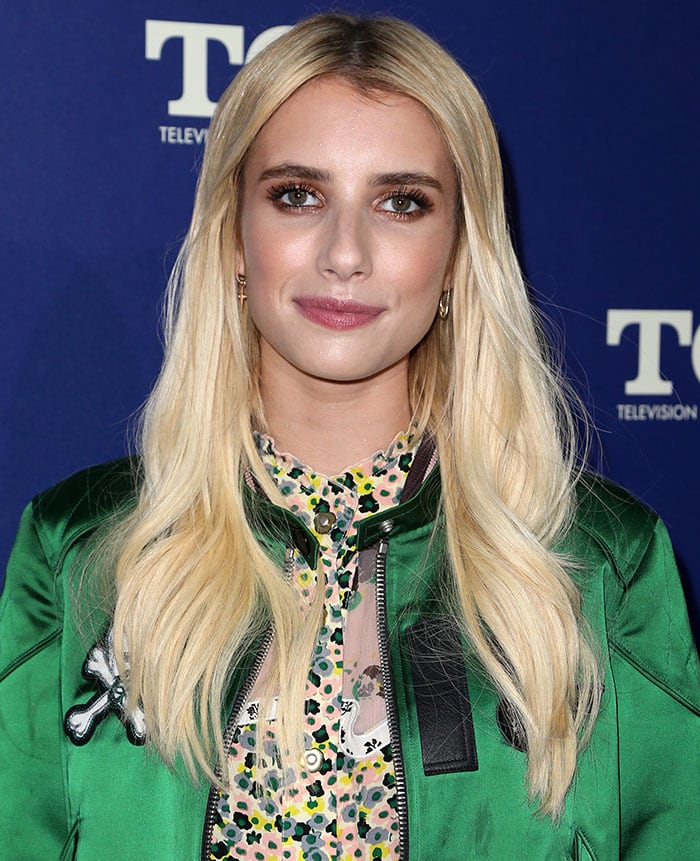 Emma Roberts rocks a reflective green bomber jacket