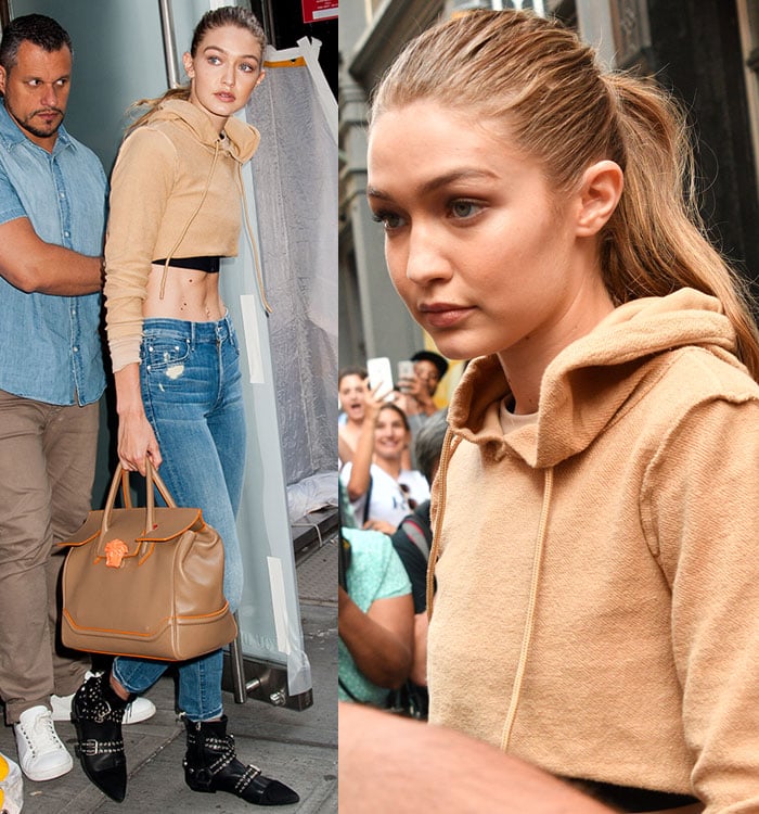 Gigi Hadid effortlessly blending casual and chic in a Danielle Guizio camel khaki sweatsuit, Mother high-waisted Looker jeans in Graffiti Girl, Isabel Marant Fall 2016 Eyelet Rolling boots, and a Versace Palazzo Empire bag