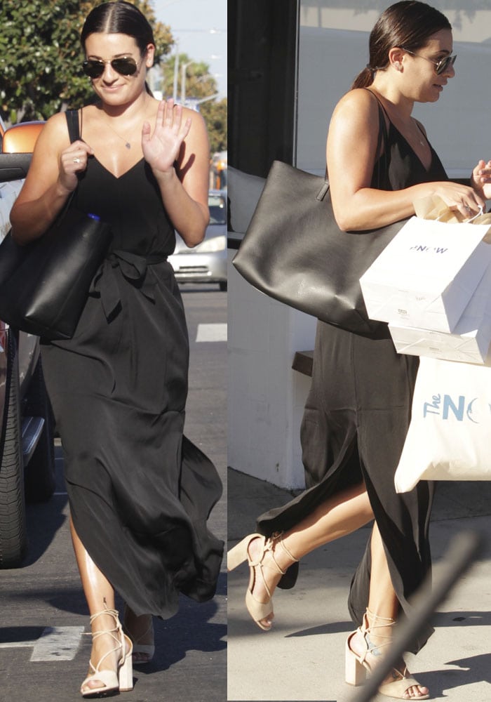 Lea Michele exudes effortless style in a flowing black maxi dress paired with Aquazzura nude suede sandals and a chic Saint Laurent tote during her casual outing in West Hollywood