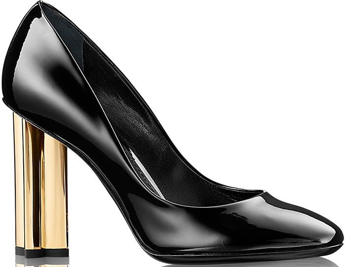 Louis Vuitton “Night Bloom” pumps in glossy black patent leather with sculptural gold Monogram flower heels, originally retailing for $880