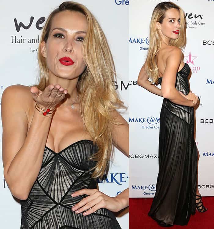 Petra Němcová shows off her red lipstick as she blows a kiss from the red carpet