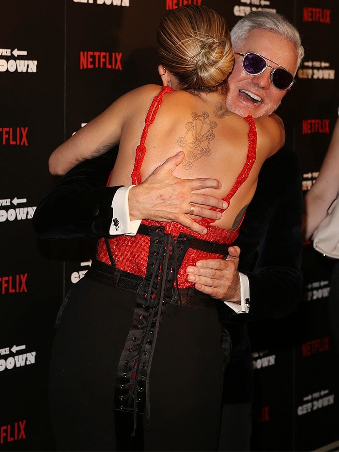 Rita Ora shares a warm embrace with director Baz Luhrmann at The Get Down premiere