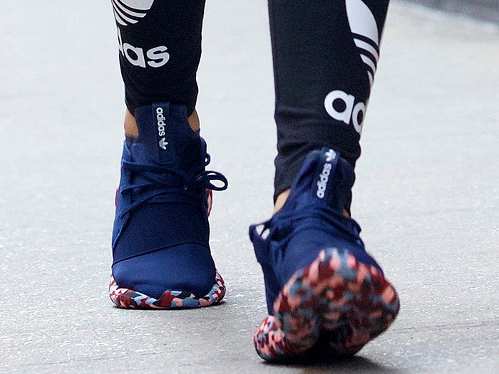 Rita Ora wearing her navy Adidas Originals Tubular Defiant sneakers from the Color Paint Pack