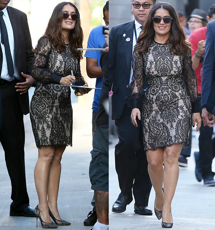 Salma Hayek leaves ABC Studios, showcasing her feminine figure in a form-fitting black lace mini dress from Alexander McQueen, complete with bishop sleeves