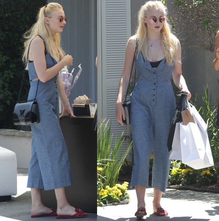 Sophie Turner carries several shopping bags and a black Louis Vuitton chain purse