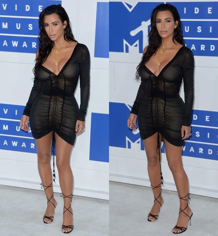 Kim Kardashian turns heads at the 2016 MTV Video Music Awards in a daring sheer black dress paired with strappy heels and layered gold necklaces