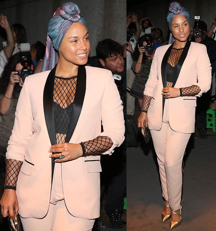 Alicia Keys flashed a hint of cleavage and abs in Tom Ford blush suit