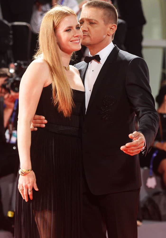 Amy's co-star Jeremy Renner couldn't keep his hand (and lips) off the actress