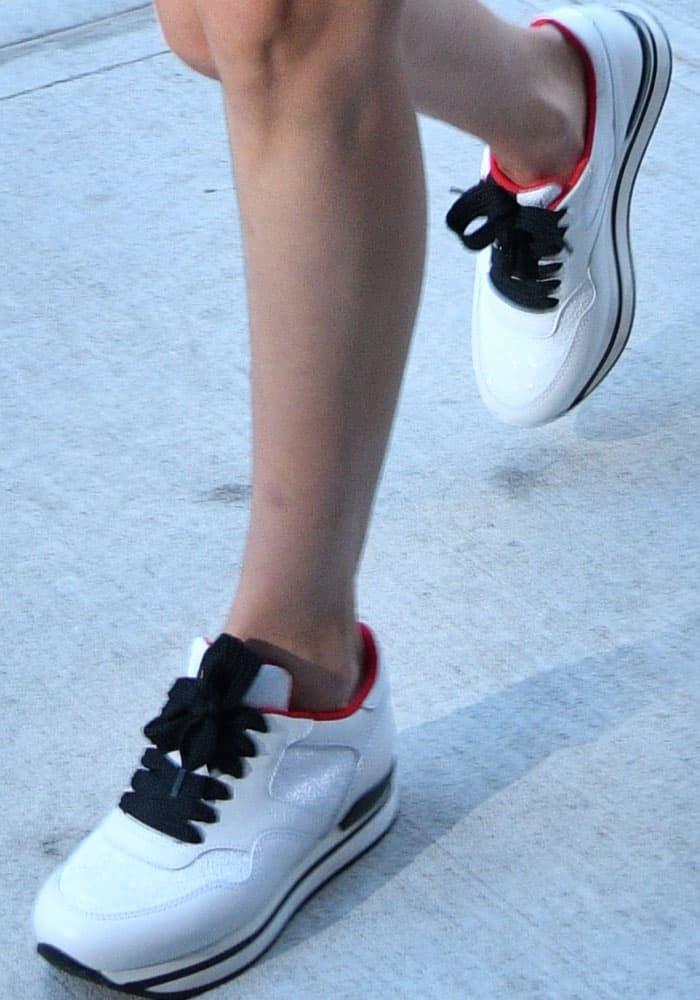 Bella Hadid pulls off the athleisure trend in the Hogan 'H222' sneakers