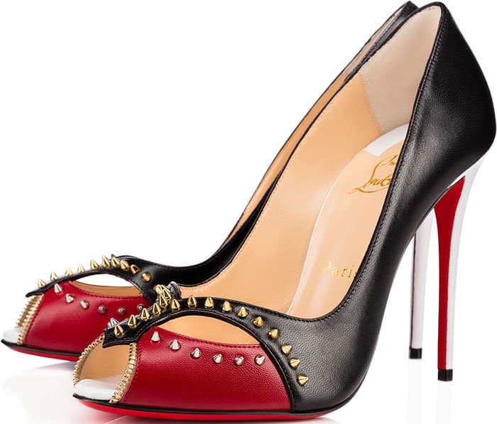 Dakota Fanning chose the red-and-black Christian Louboutin Cagouletta pumps, letting the bold color blocking and gold spike embellishments add a striking, fashion-forward edge to her romantic Dolce Gabbana Venice Film Festival look