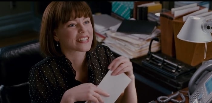 Elizabeth Banks as Betty Brant wears a vintage-inspired polka-dot blouse in Spider-Man