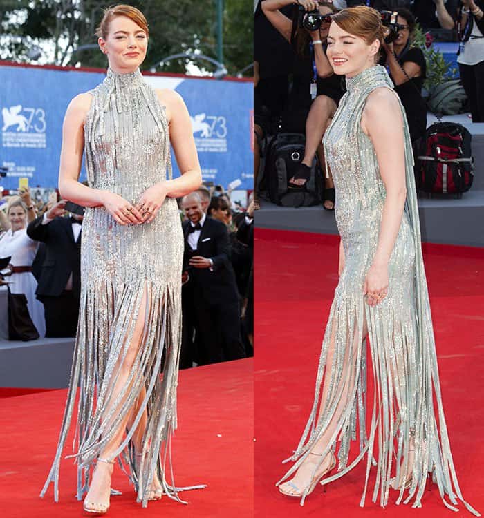Emma Stone strikes elegant poses on the red carpet, effortlessly showcasing the flowing fringe and shimmering details of her silver Atelier Versace gown