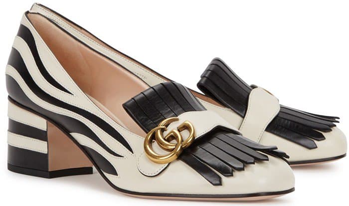 Kiltie fringe adds preppy elegance to a sleek, rounded square-toe pump set on a low chunky heel