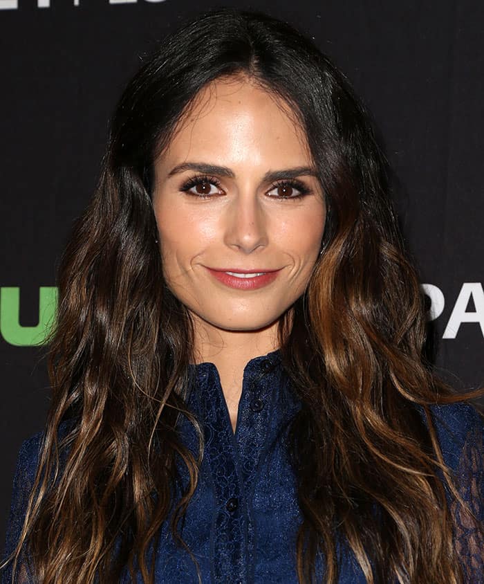 Jordana Brewster wore her wavy hair loose and opted for bold mascara, eyeliner, and a dash of red lipstick