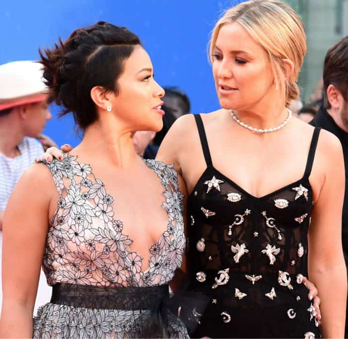 Kate Hudson shared a candid moment with co-star Gina Rodriguez, offering a glimpse of camaraderie behind the glamour at the festival premiere