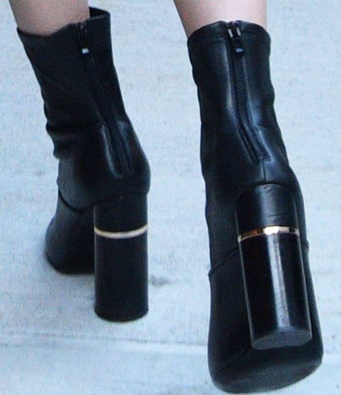 Kendall Jenner shows off the sleek block heels and gold-band detailing of her 3.1 Phillip Lim ‘Kyoto’ leather booties — a bold, architectural style that elevated her off-duty NYFW look