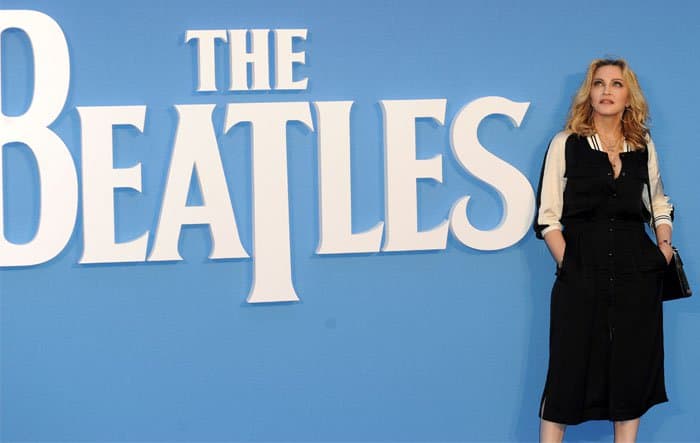 Standing beneath The Beatles’ iconic logo, Madonna strikes a composed pose that underscores the cultural significance of the film premiere she attended