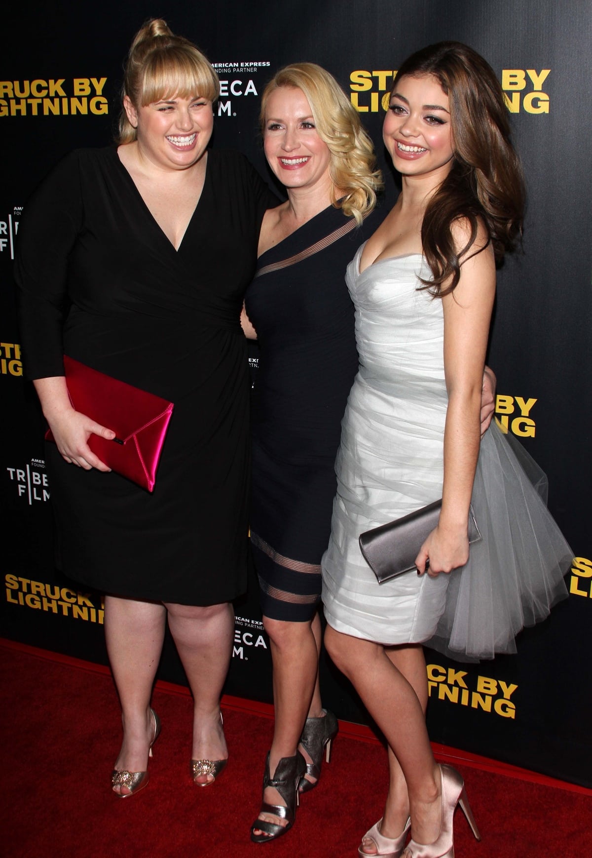 Rebel Wilson in gold-tone sandals and a wrap LBD, Angela Kinsey in silver cutout heels and a navy sheath, and Sarah Hyland in blush satin peep-toe pumps