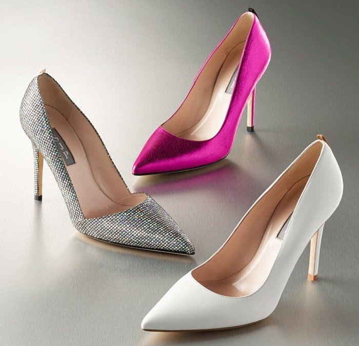 SJP by Sarah Jessica Parker “Rampling” pumps appear in signature variations including crystal-embellished silver, vibrant fuchsia satin, and classic white leather, showcasing the sleek pointed-toe silhouette and slim stiletto heel that defined the brand’s elegant aesthetic