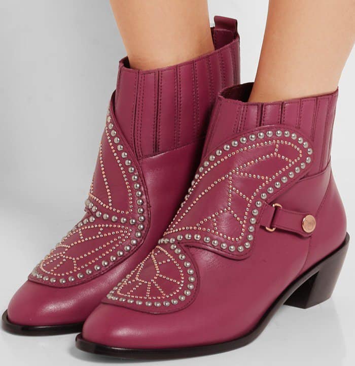 This pair is embellished with gleaming rose gold studs to form the signature butterfly motif