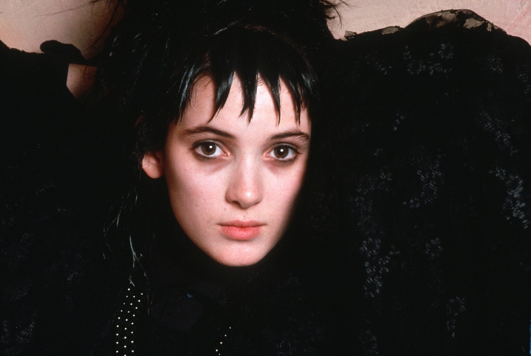 Winona Ryder channels gothic charm as Lydia Deetz in Tim Burton’s 1988 classic Beetlejuice — the breakout role that defined her darkly elegant aesthetic