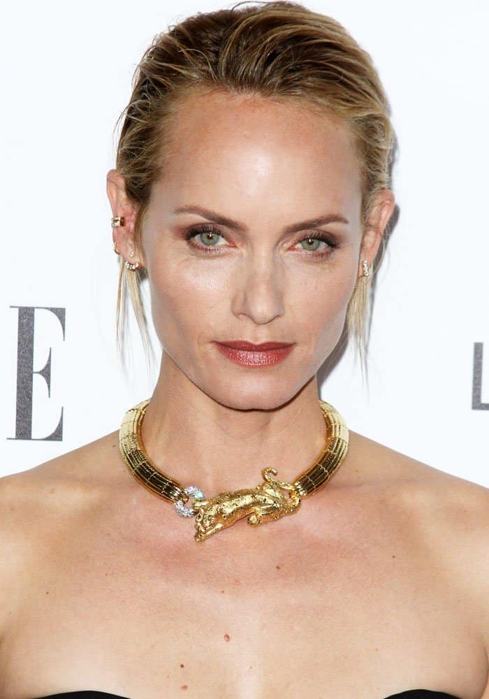 Amber Valletta makes a statement with a striking gold necklace featuring an intricate panther design at the 2016 ELLE "Women in Hollywood" Awards