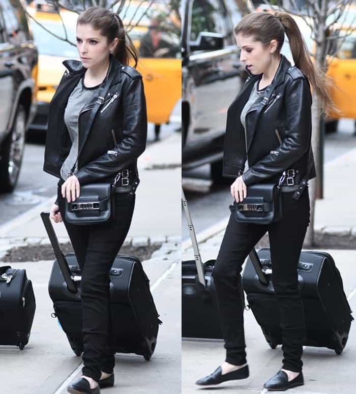 Anna Kendrick nails effortless airport style in an edgy black leather jacket, sleek Proenza Schouler PS11 bag, and chic loafers while leaving her NYC hotel on October 28, 2016
