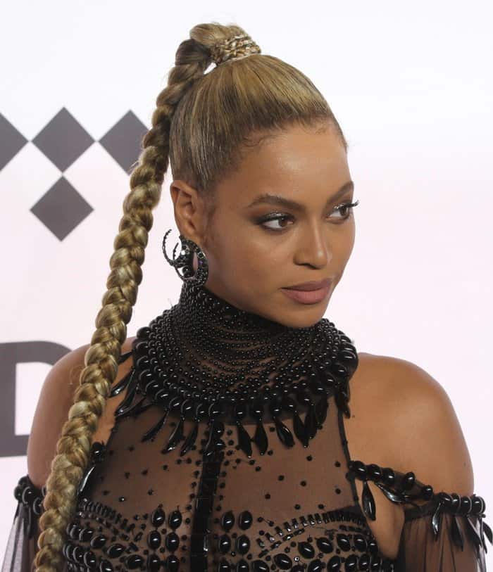 Beyoncé commands attention in a daring, beaded Gattinoni Couture gown, featuring intricate embellishments and sheer panels
