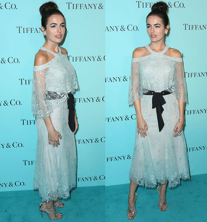 Camilla Belle's Monique Lhuillier dress features an off-the-shoulder bodice with Chantilly lace overlay